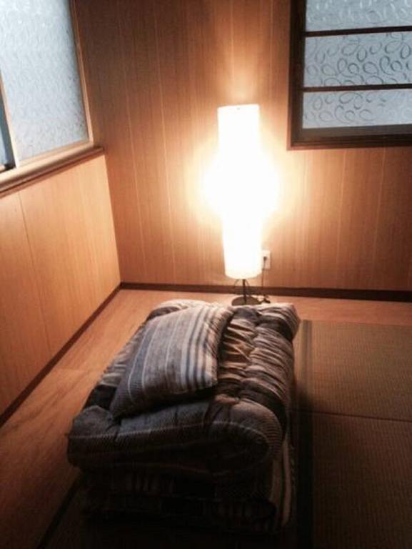 Gomaharu Guesthouse Osaka Bagian luar foto